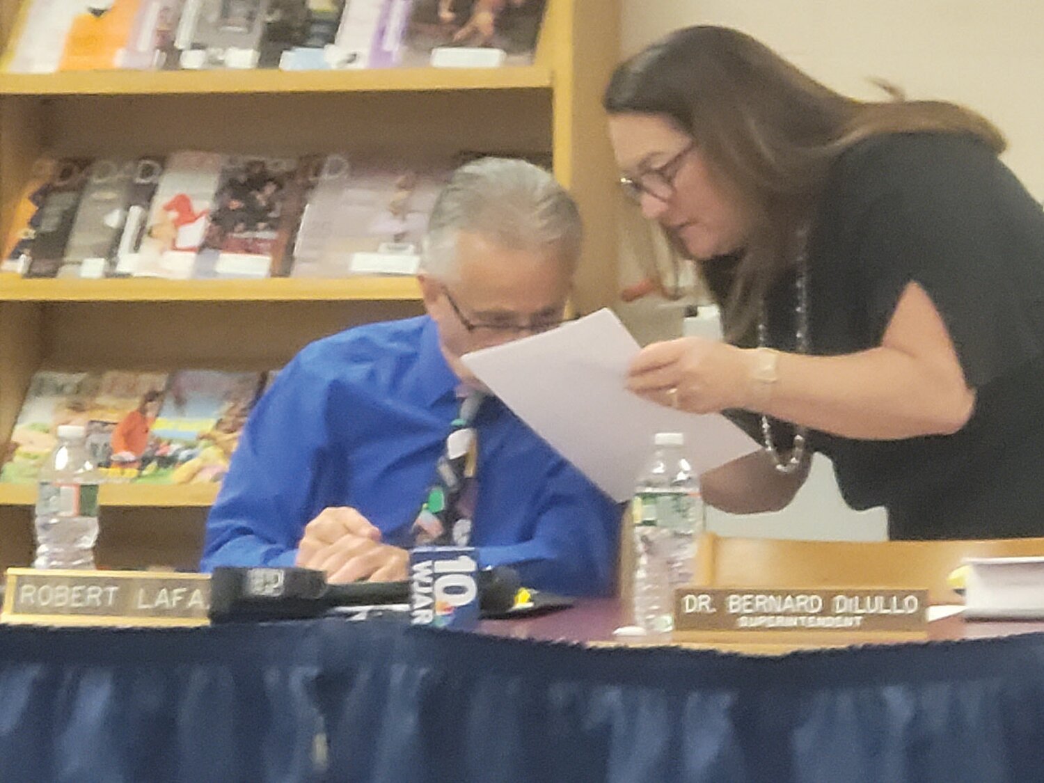 TAKING A STAND: Earlier this summer, after the mayor announced an attempted 'takeover' of school finances, School Committee Chairman Robert LaFazia and member Susan Mansolillo conferred prior to announcing the board's response.